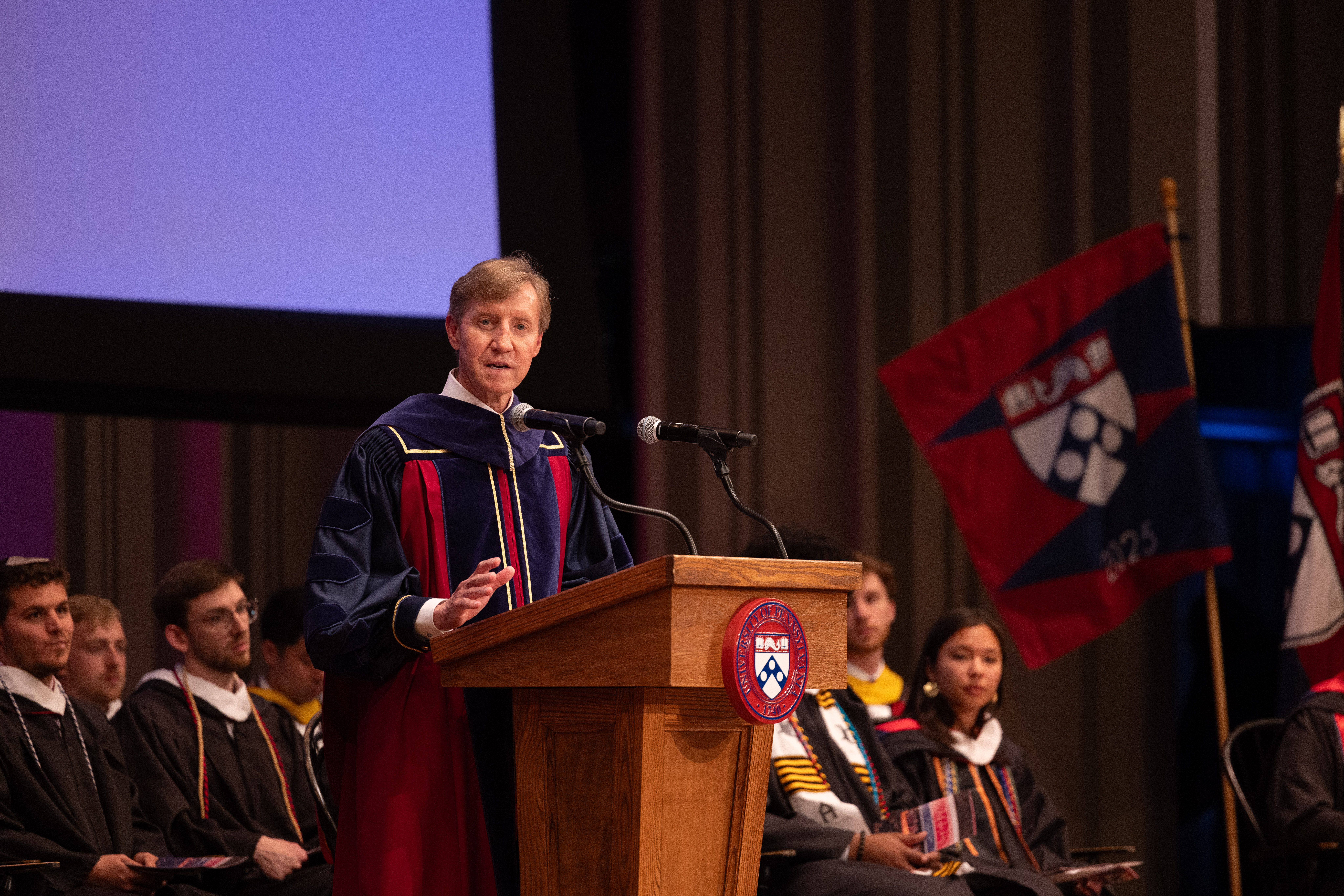 Penn president J. Larry Jameson speaking at the podium at Penn’s Baccalaureate celebration.