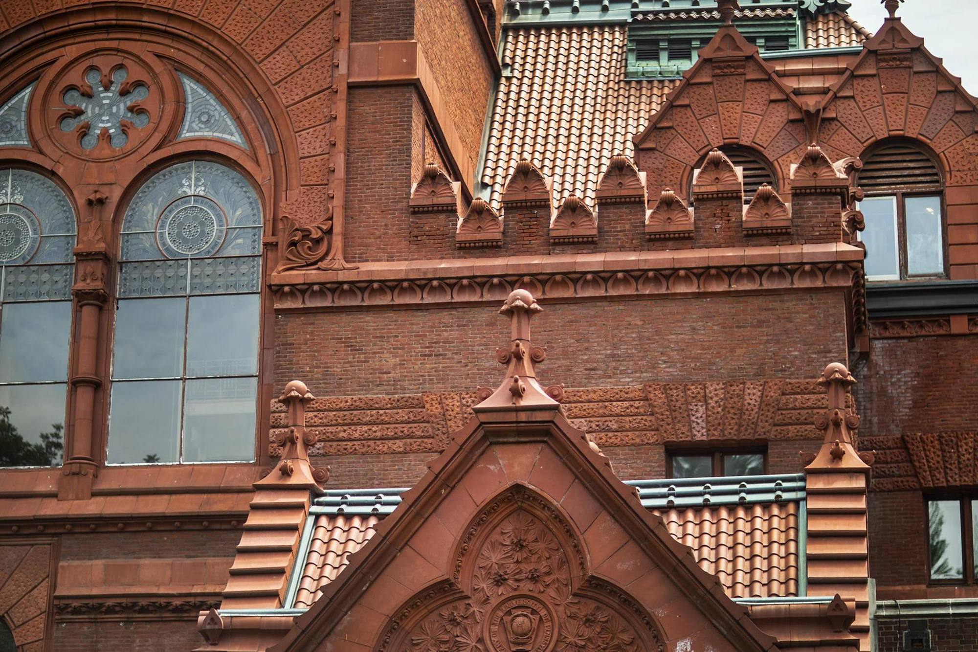 exterior of brick and terracotta building with leaded glass windows