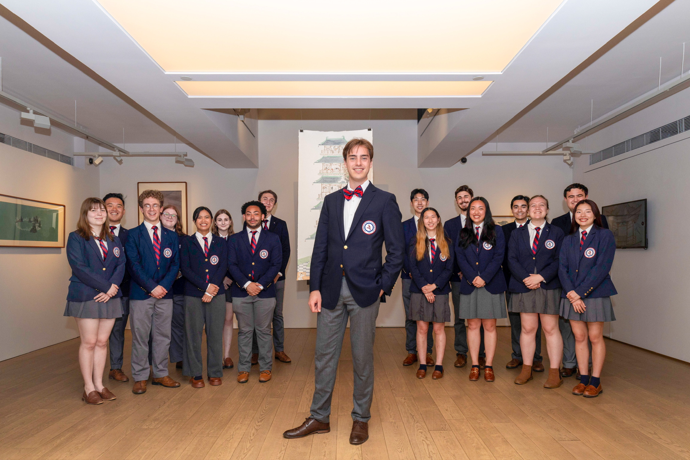 glee club members standing in art gallery