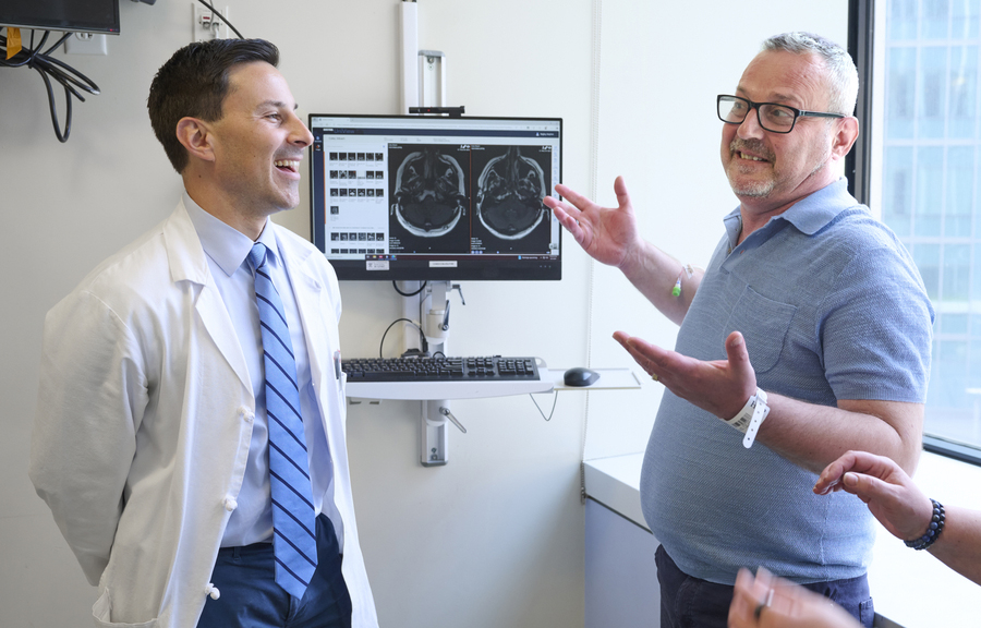 Stephen Bagley and Eduart Cuka looking at an MRI.