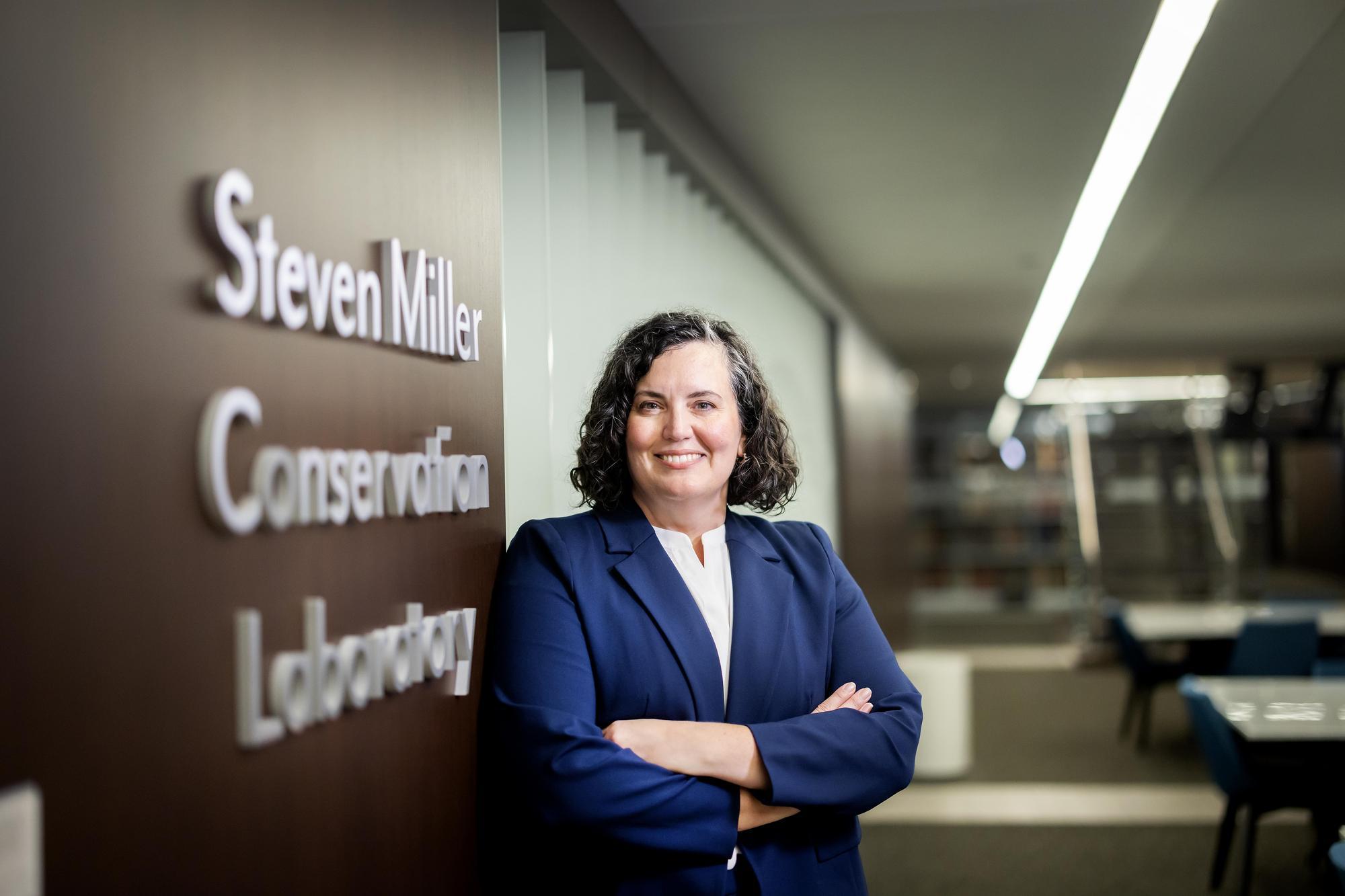 Sarah Reidell standing outside the Steven Miller Conservation Laboratory