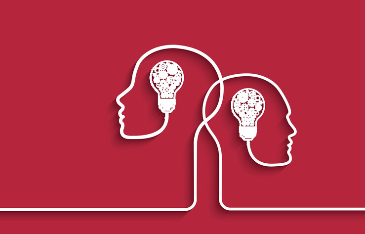 line drawing of two heads and lightbulbs implying intelligence