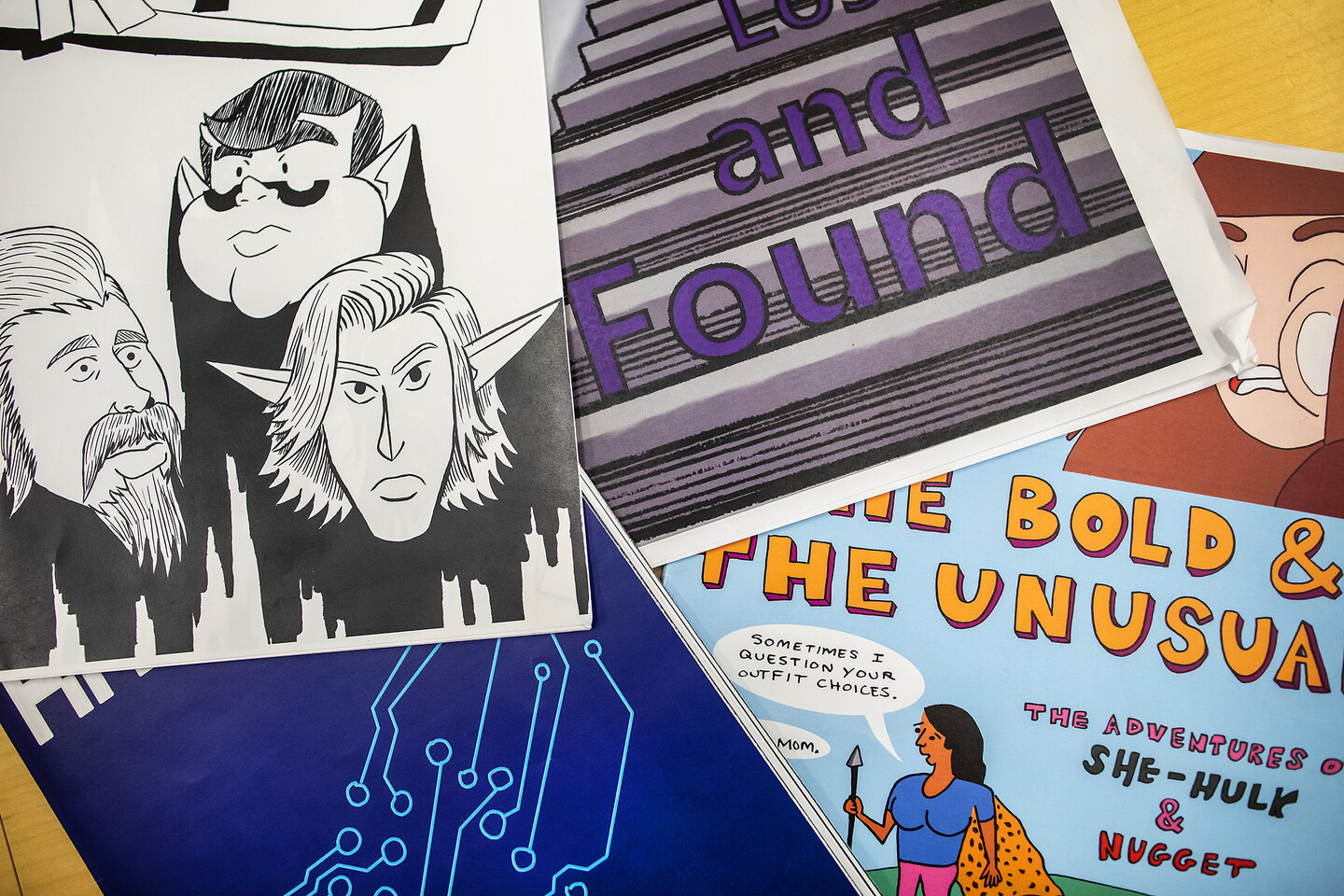Student-made comics scattered on a table