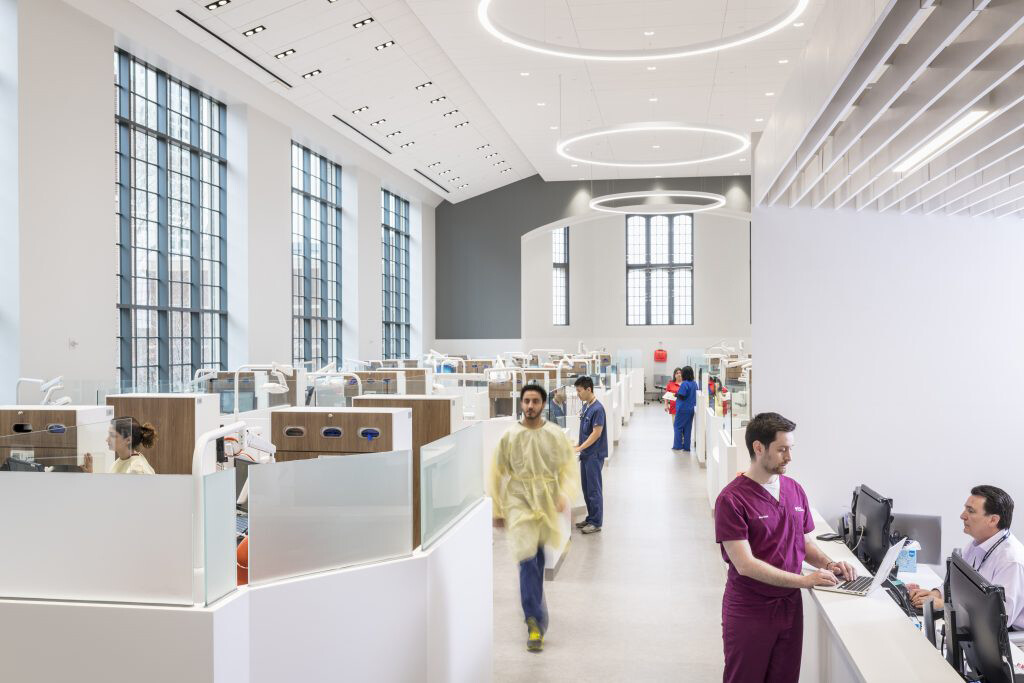 View inside Penn Dental Medicine hallway and cubicles with personnel