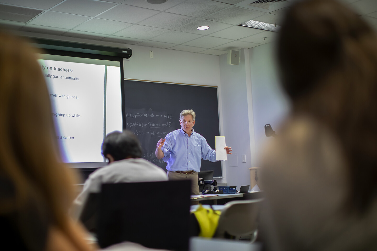 GSE Richard Ingersoll lecturing with students out of focus in foreground