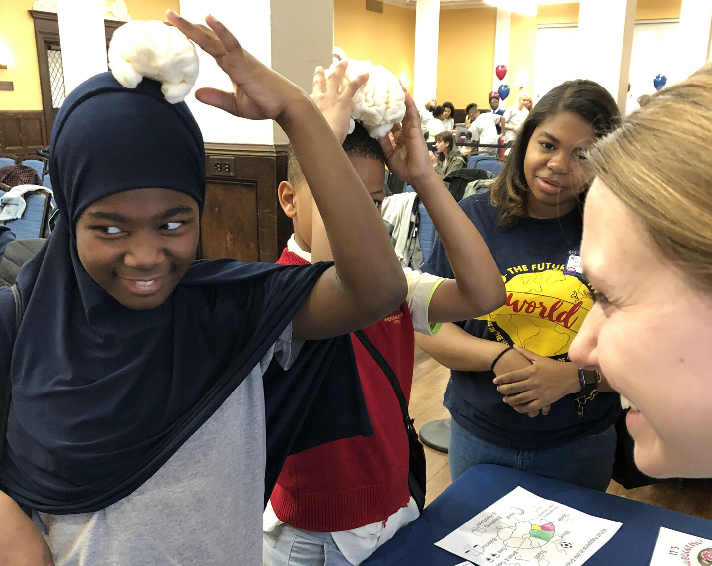 Elementary school students with model brains