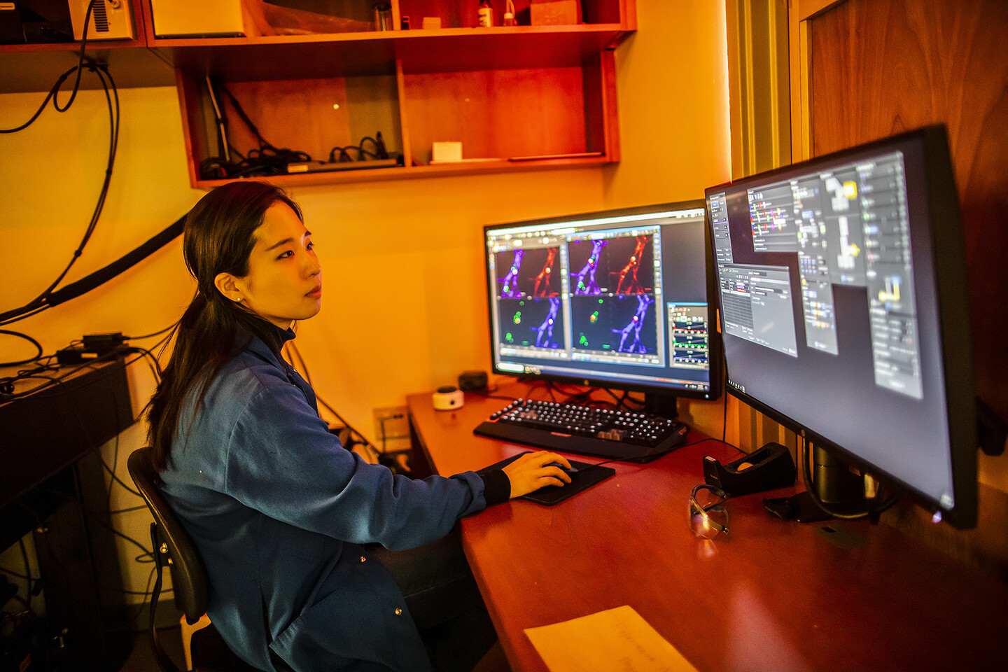 jun looking at computer monitors