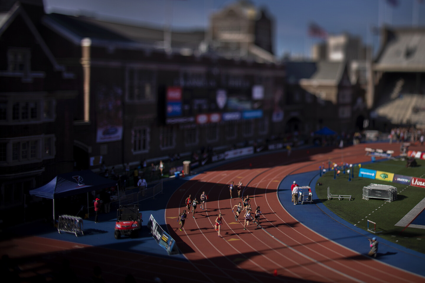 Runners race around the track at the 2018 Penn Relays.