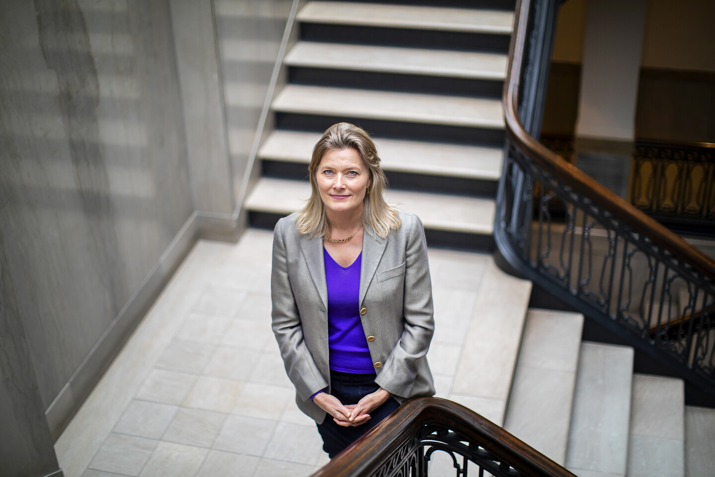 Jennifer Egan standing in grand stairwell. 
