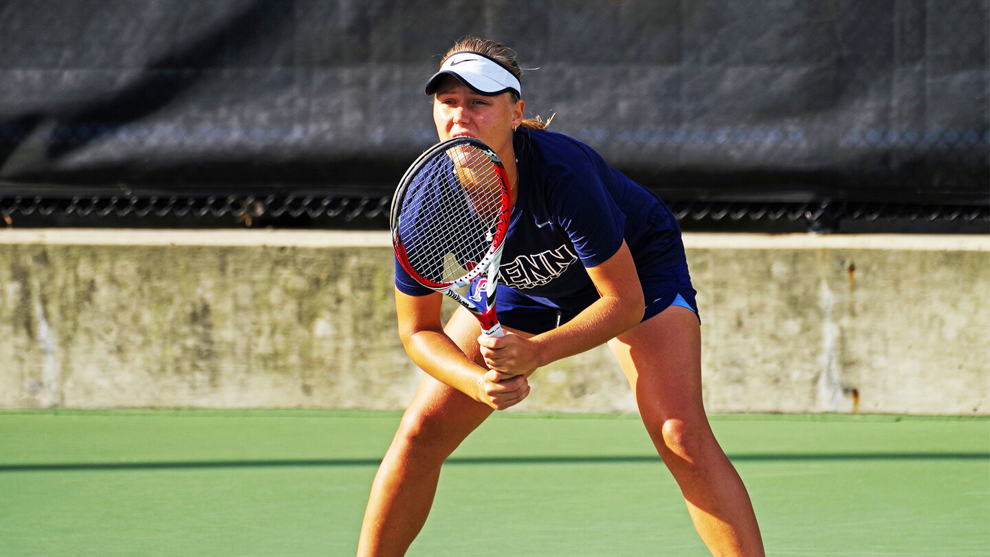 Iuliia Bryzgalova prepares to receive a serve during a match.