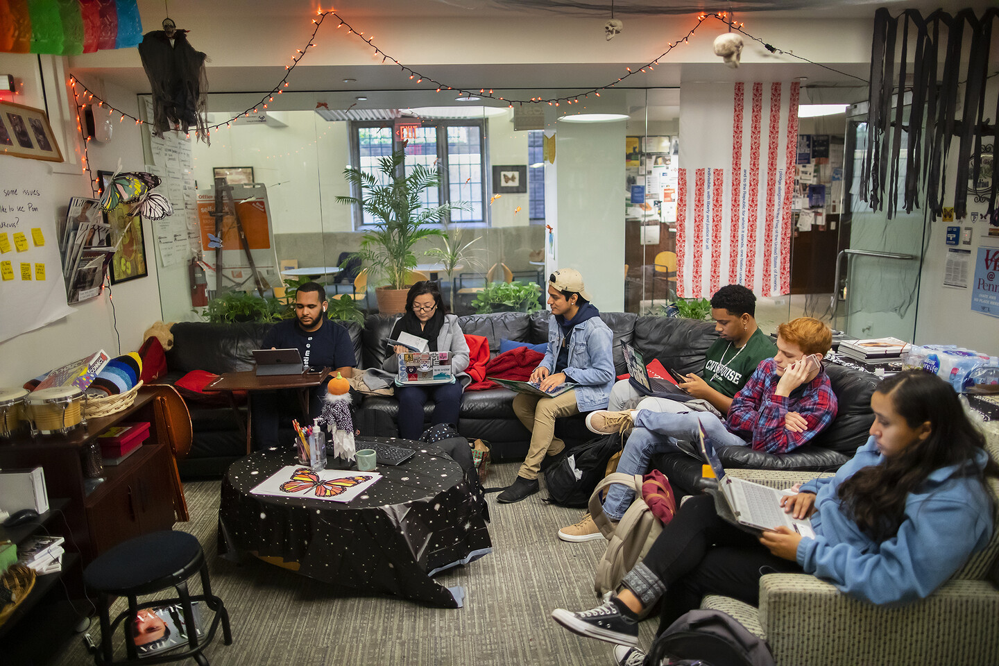 students hanging out in la casa latina in arch building