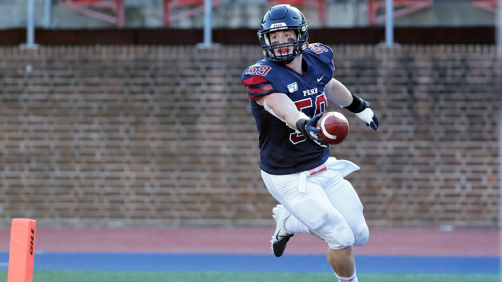 Brian O’Neill holds the ball in the endzone after scoring a touchdown against Brown.
