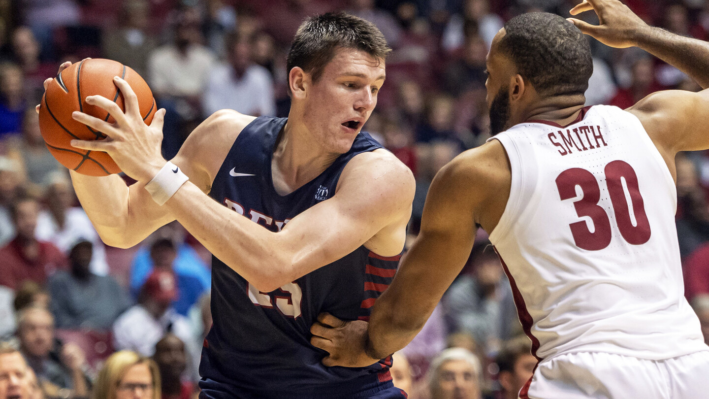 Senior forward A.J. Brodeur makes a move against a defender with the ball.
