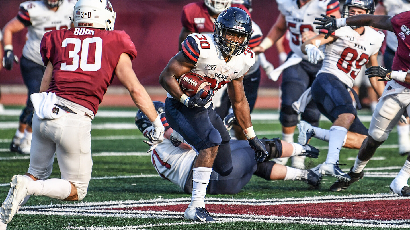 Senior running back Karekin Brooks runs through defenders.