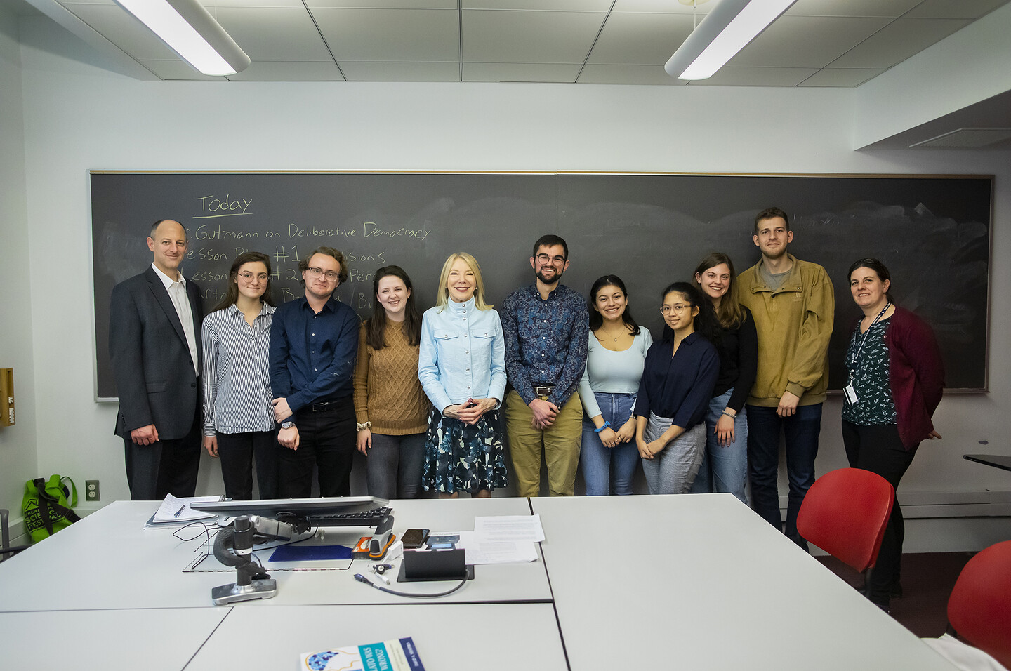 A group stands at the front of a classroom