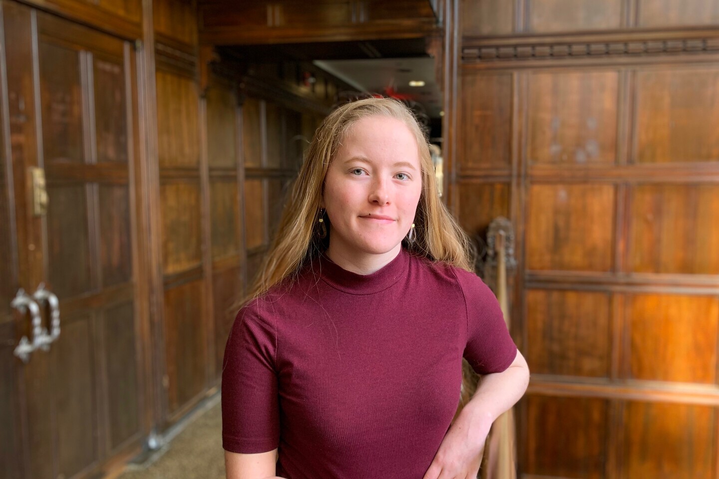 Student standing in stairwell. 