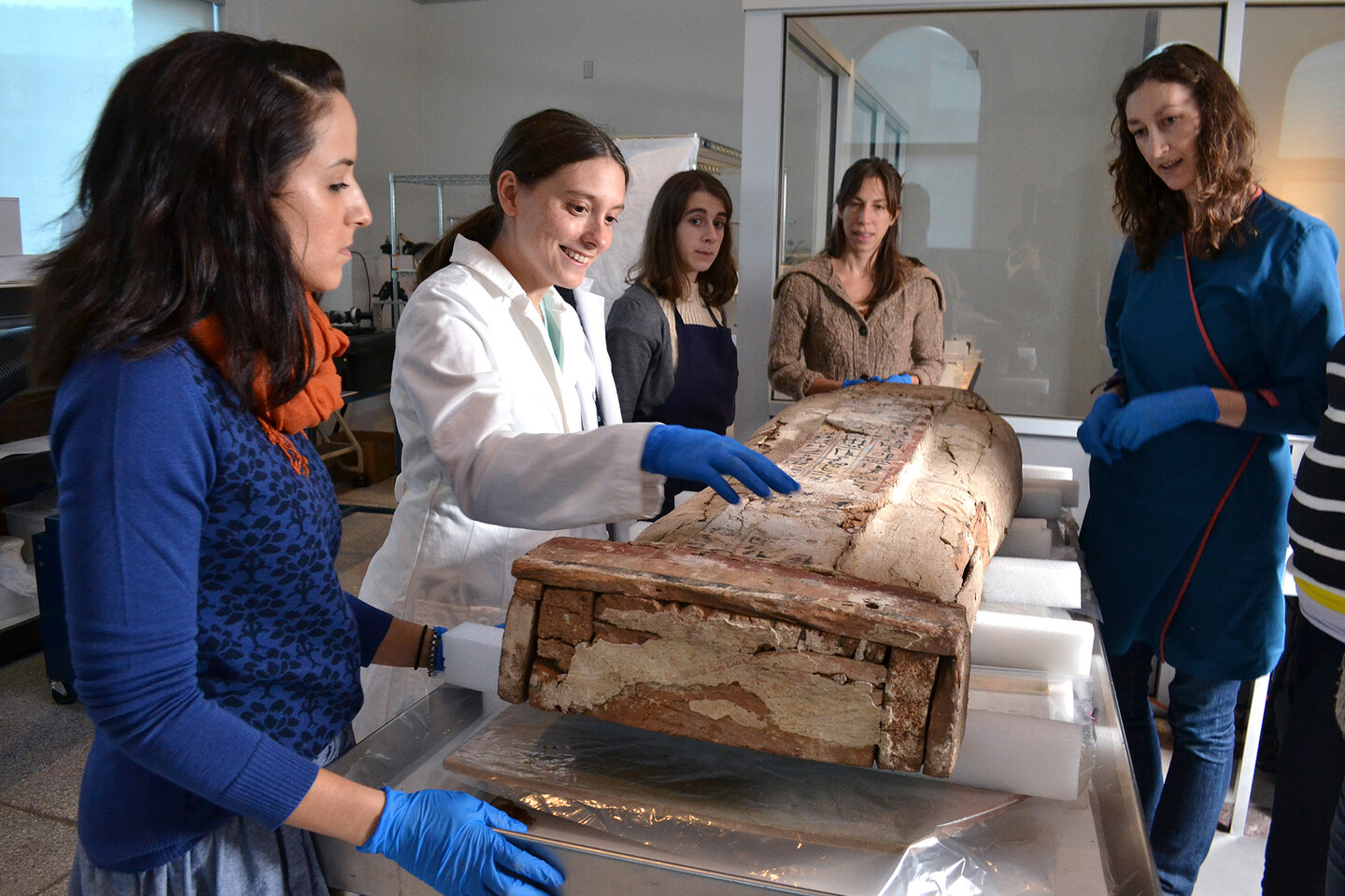 penn museum artifact lab with blue gloves