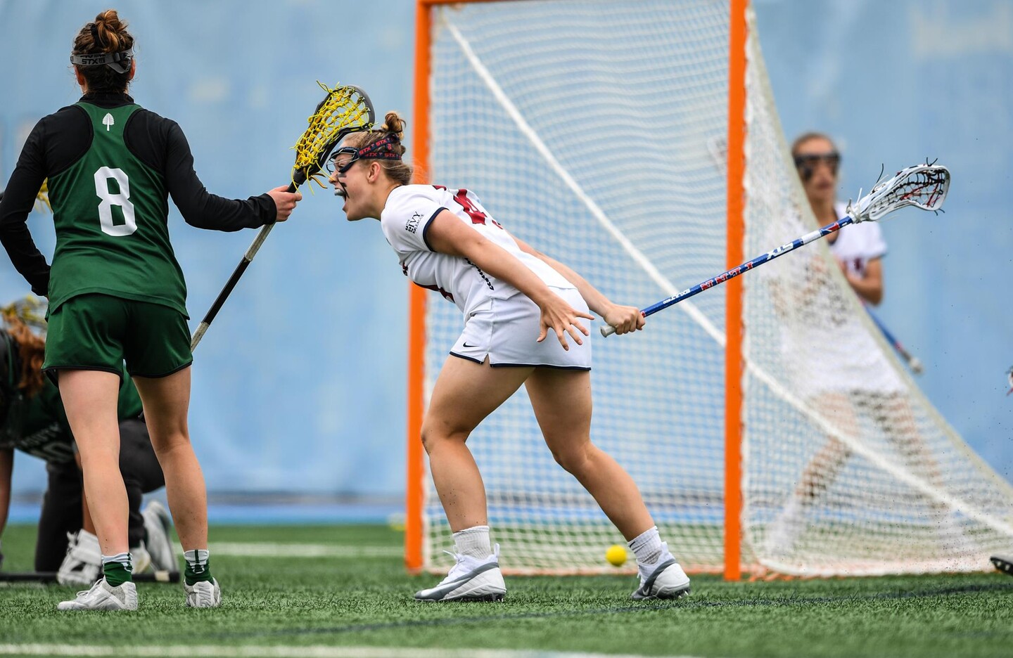 Rosenzweig bends foward with excitement after scoring a goal 