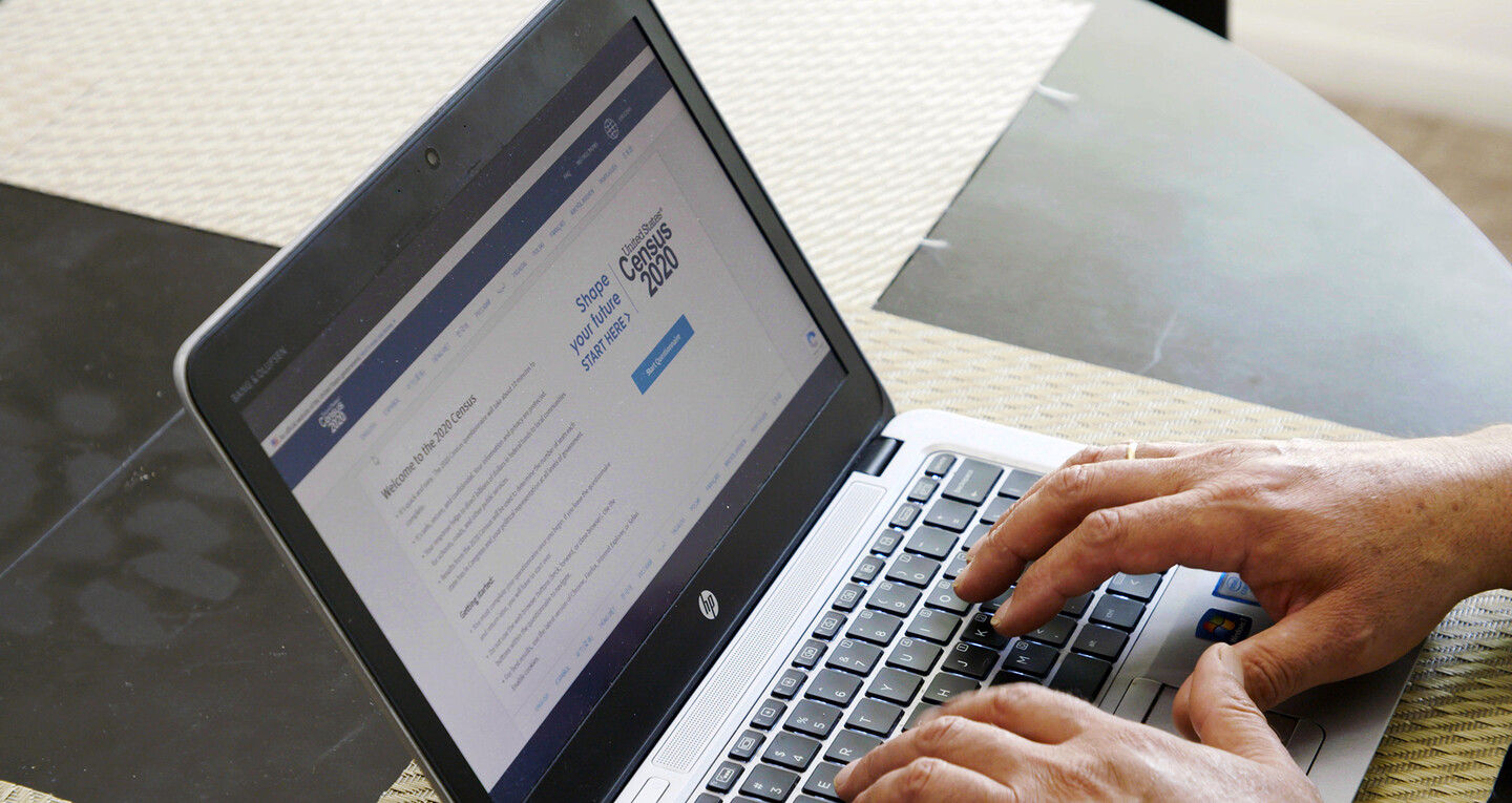 person typing on a laptop