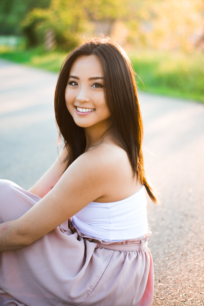 Student sitting outside in sunshine
