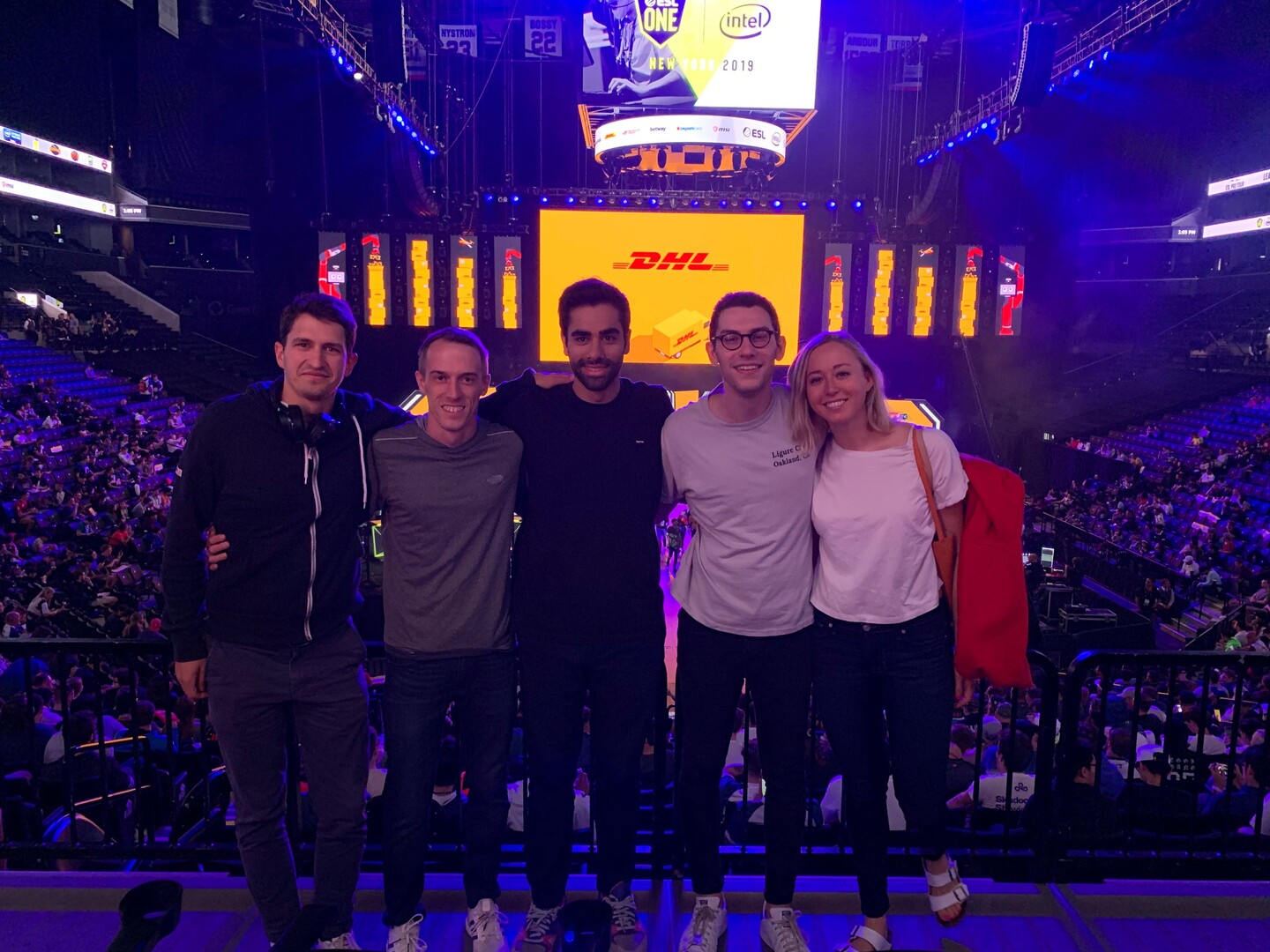 Members of the Wharton esports club huddled together at an esports gathering