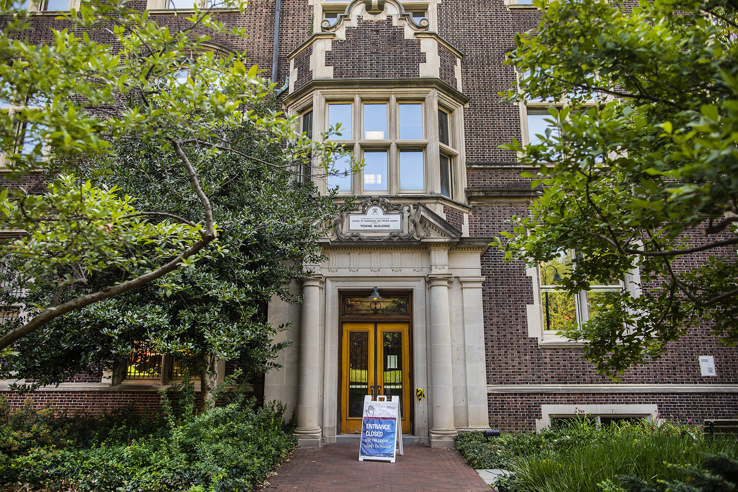 the side entrance to the Towne building with a sign saying entranced closed