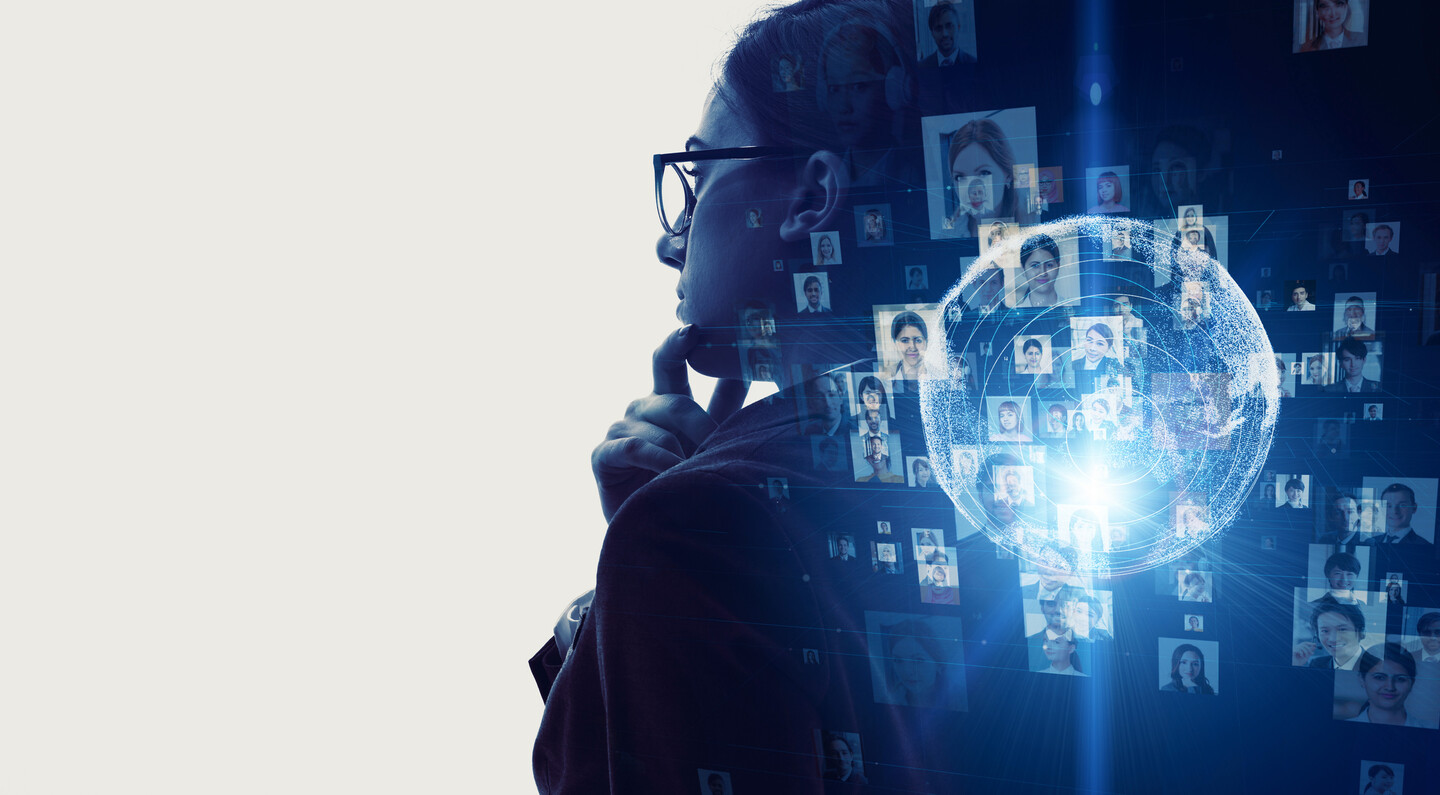 Stock image of a person staring out the window, with greyed out images of other people illuminated as if the first person is thinking about them.