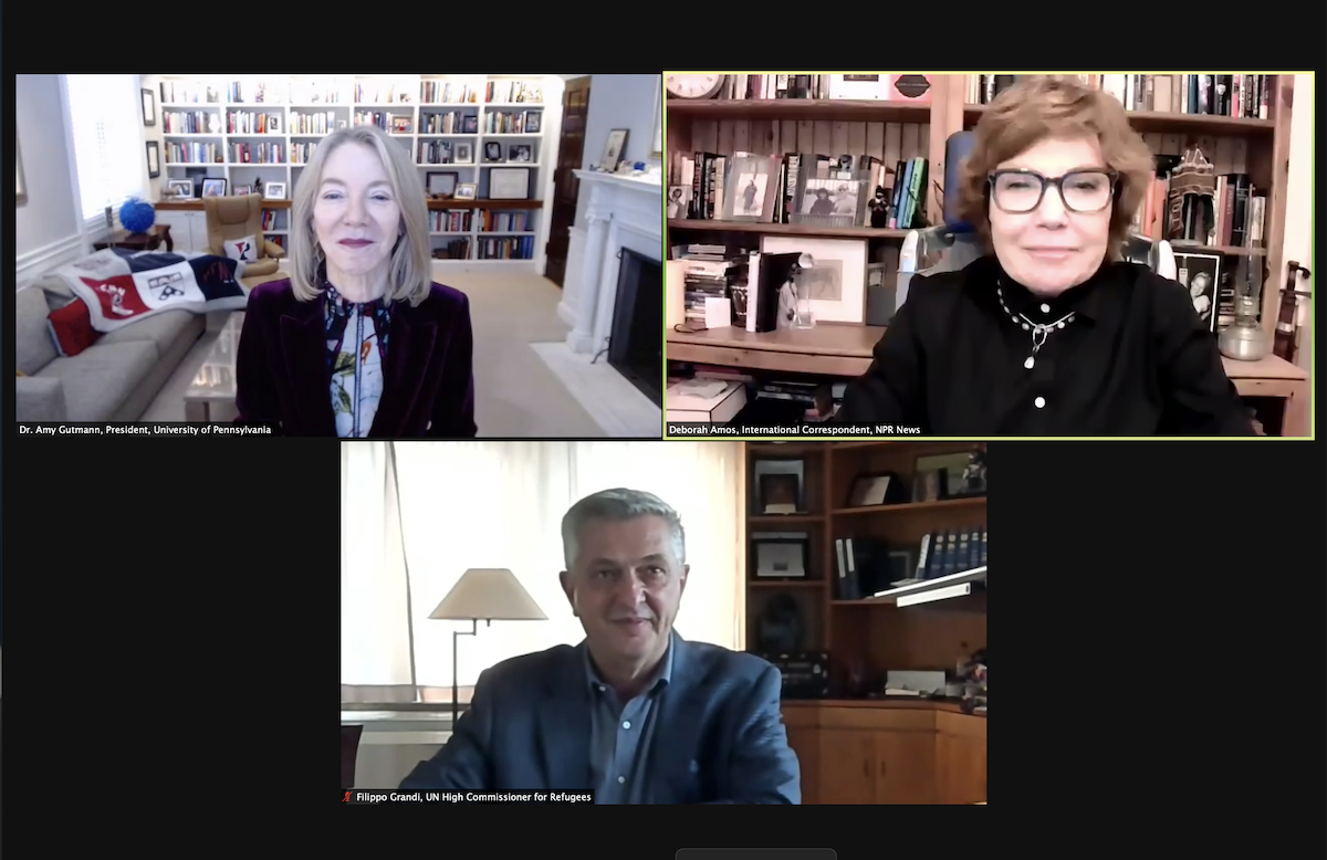 A zoom call features Penn president Amy Gutmann in the upper left screen, NPR's Deborah Amos in the upper right screen and Filippo Grandi of the UN at the bottom