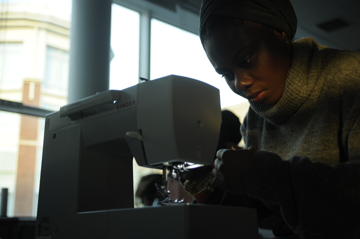 Student working at a sewing machine