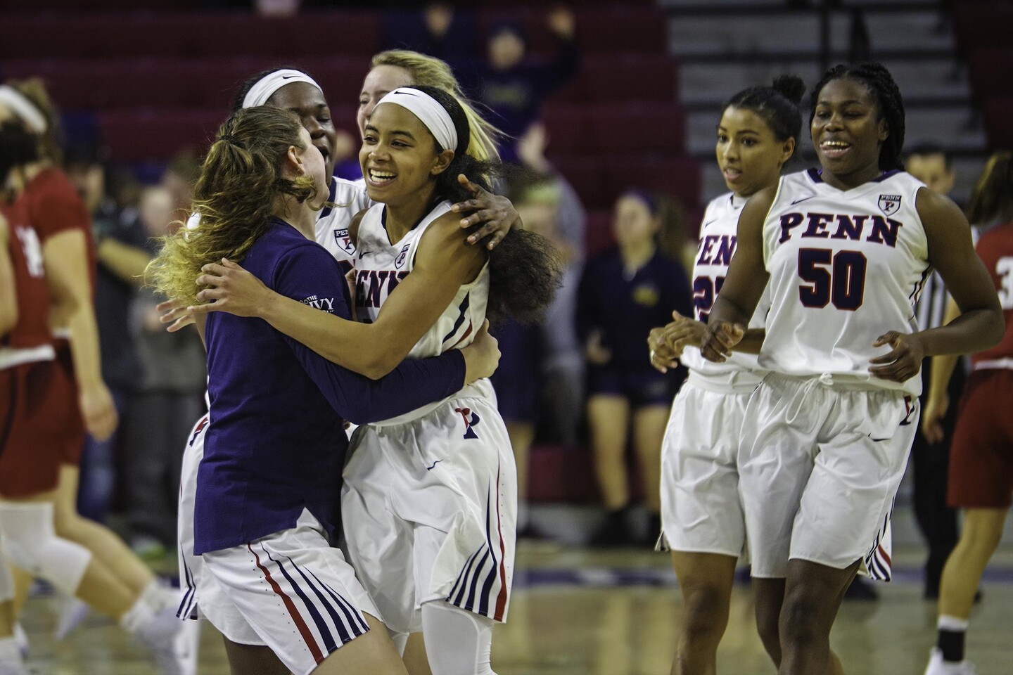 Six women hug and celebrate
