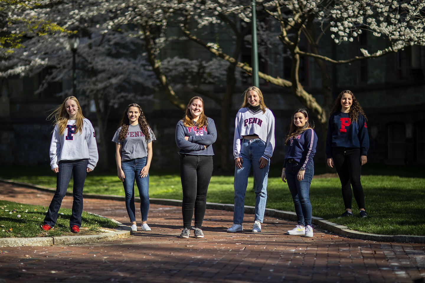 five students standing outside