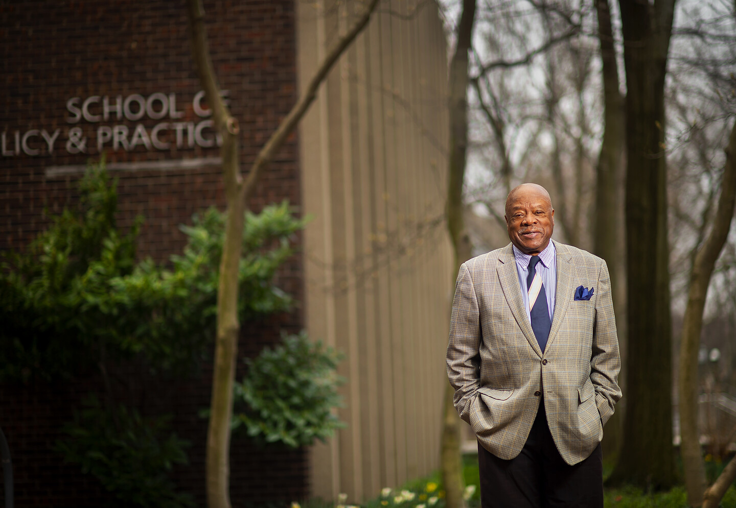 Walter Palmer stands outside the School of Social Policy & Practice.