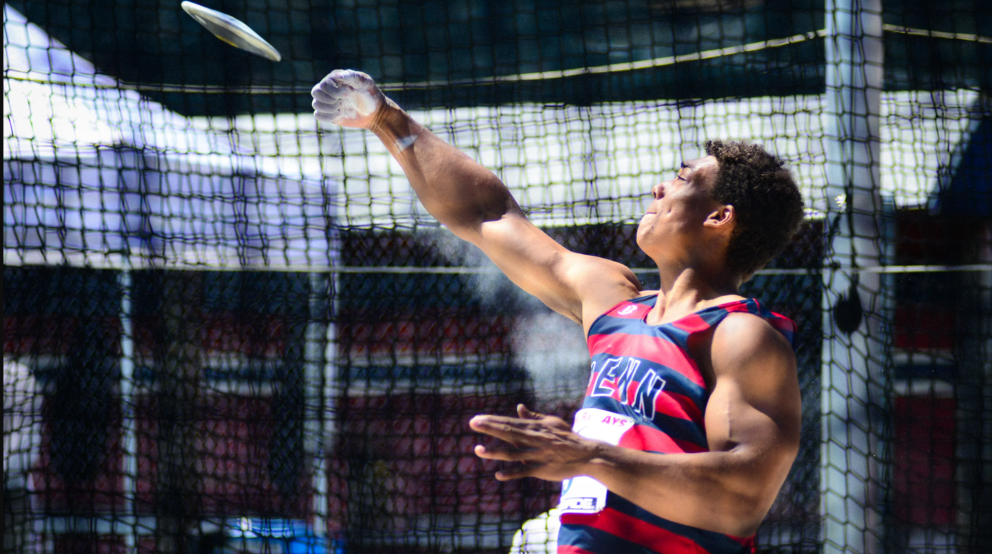 Sam Mattis throws the discus during his days at Penn.