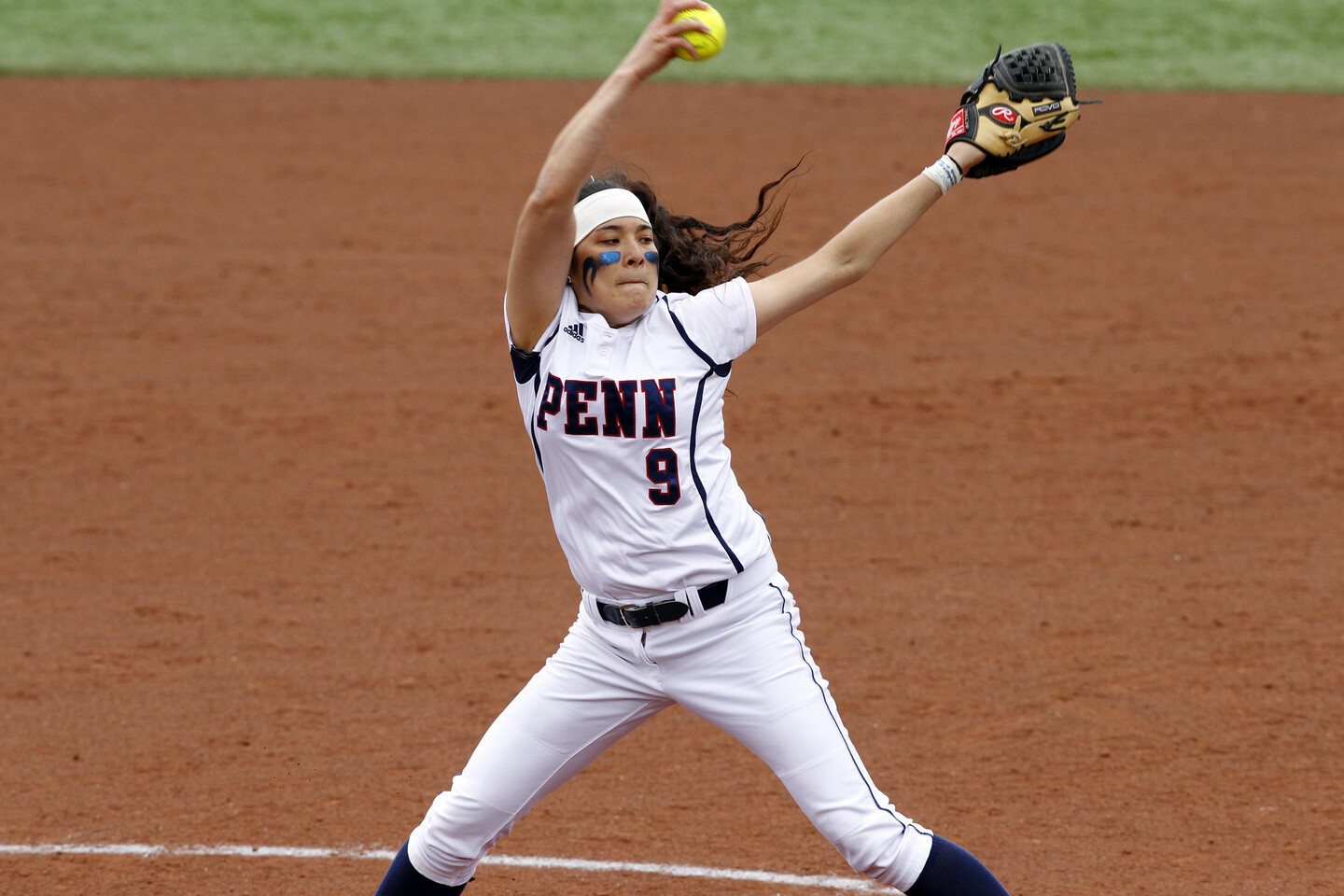 Alexis Borden, from the mound, prepares to throw a pitch to the batter.