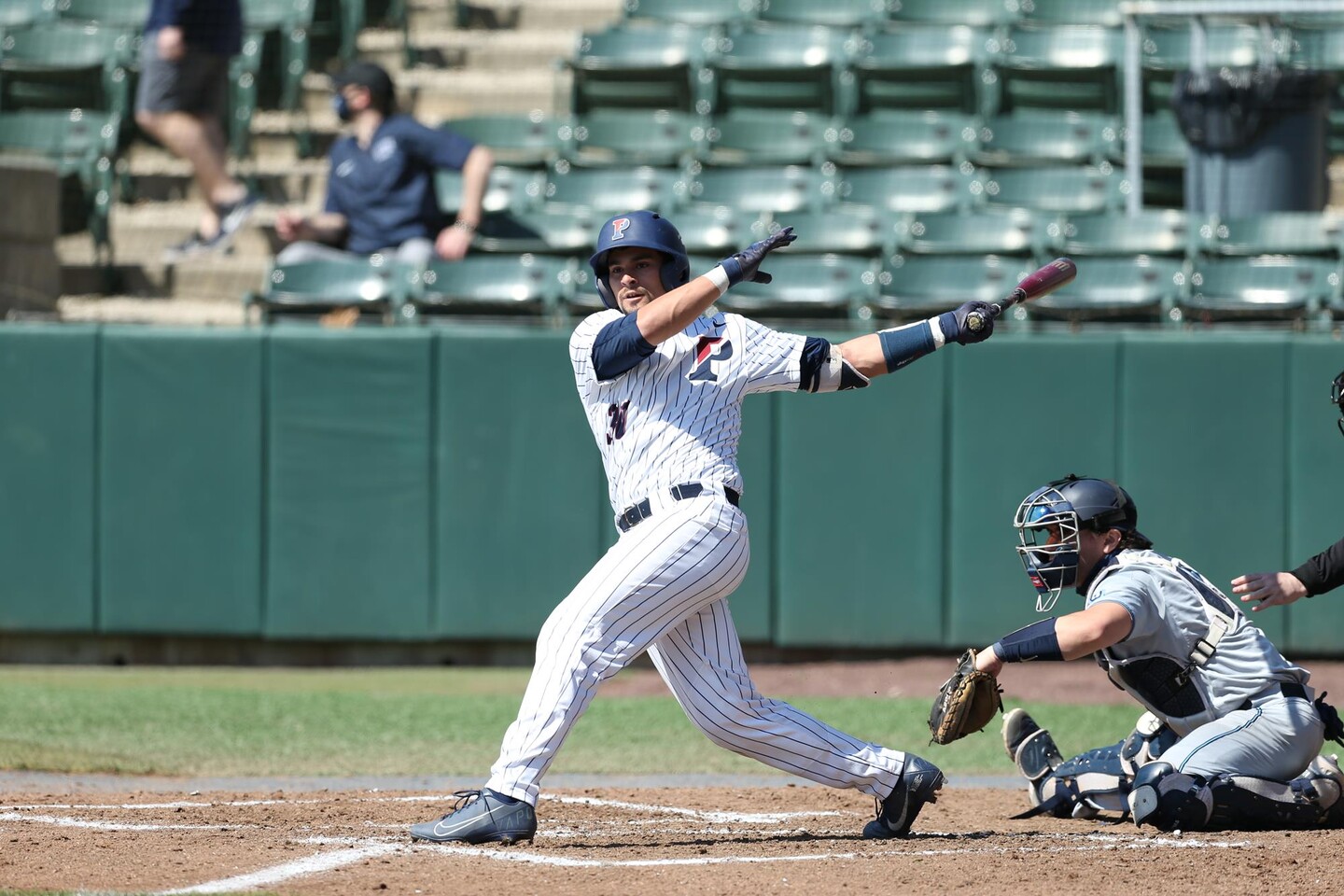 Andrew Hernandez swings at a pitch during a game.