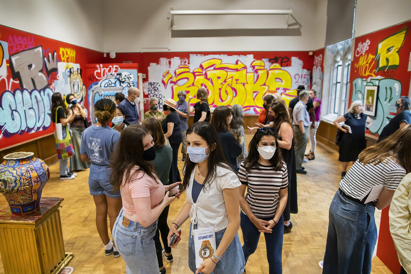 many people in art gallery