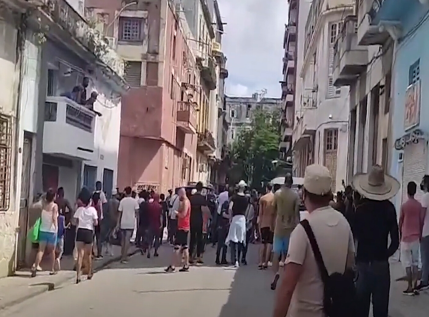 People standing on the streets of Havana in protest of the Cuban government.