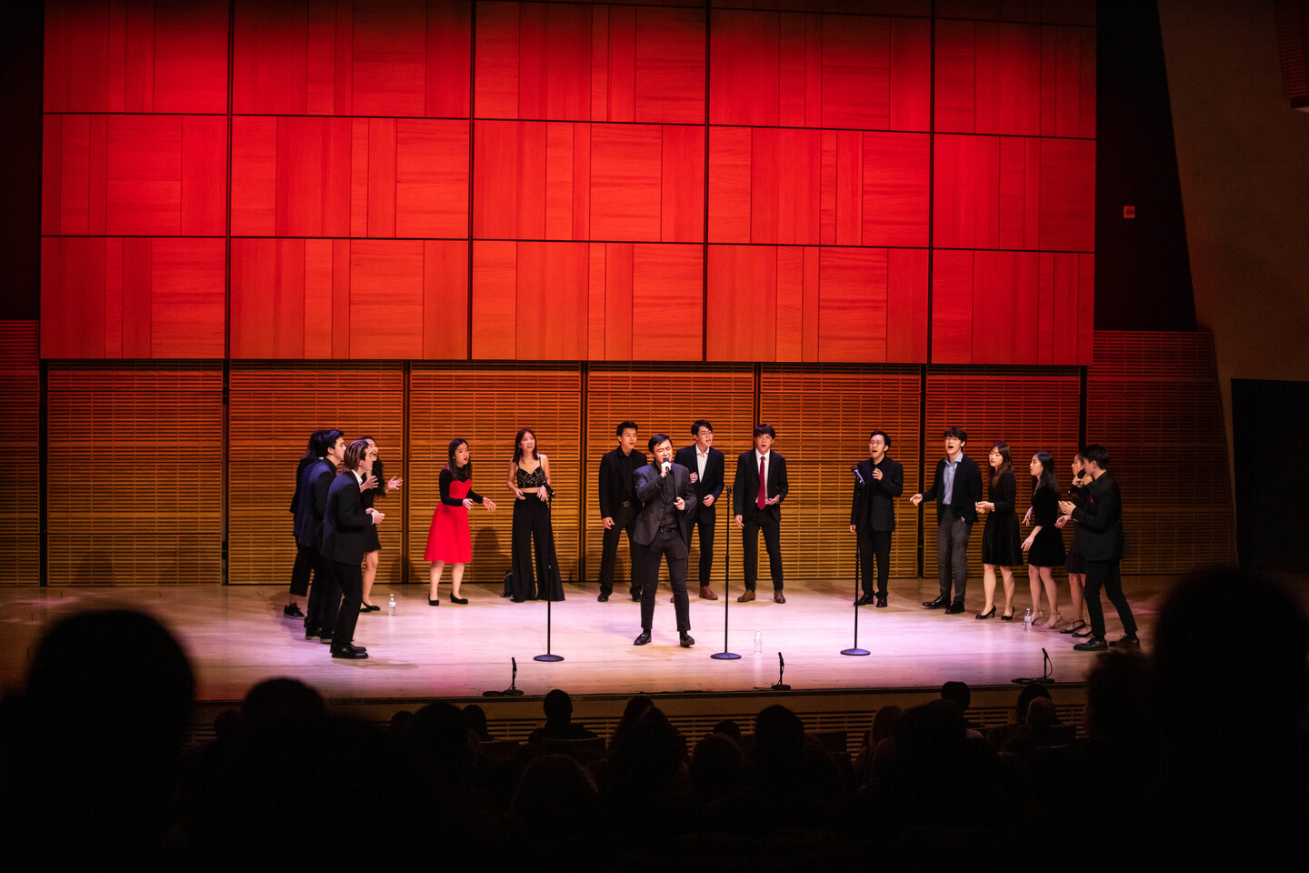 several students on stage singing