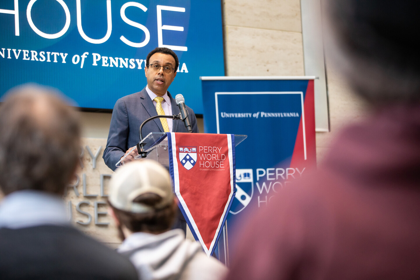 Wendell Pritchett speaks at a podium at Perry World House