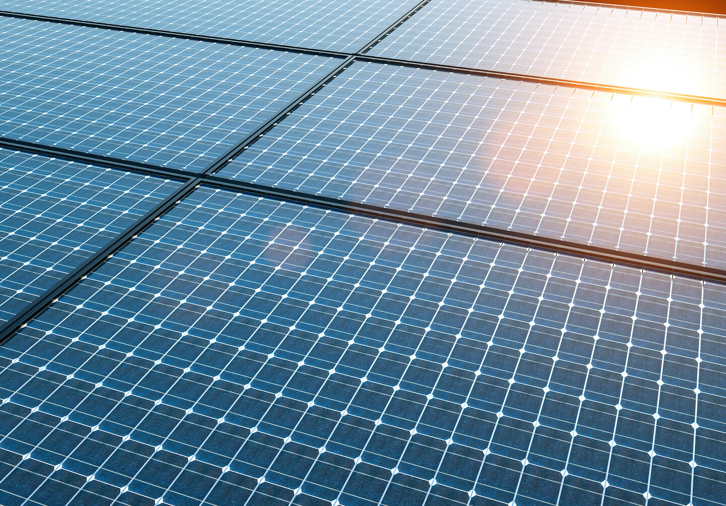 Solar panels with sunlight shining on the top right corner. 