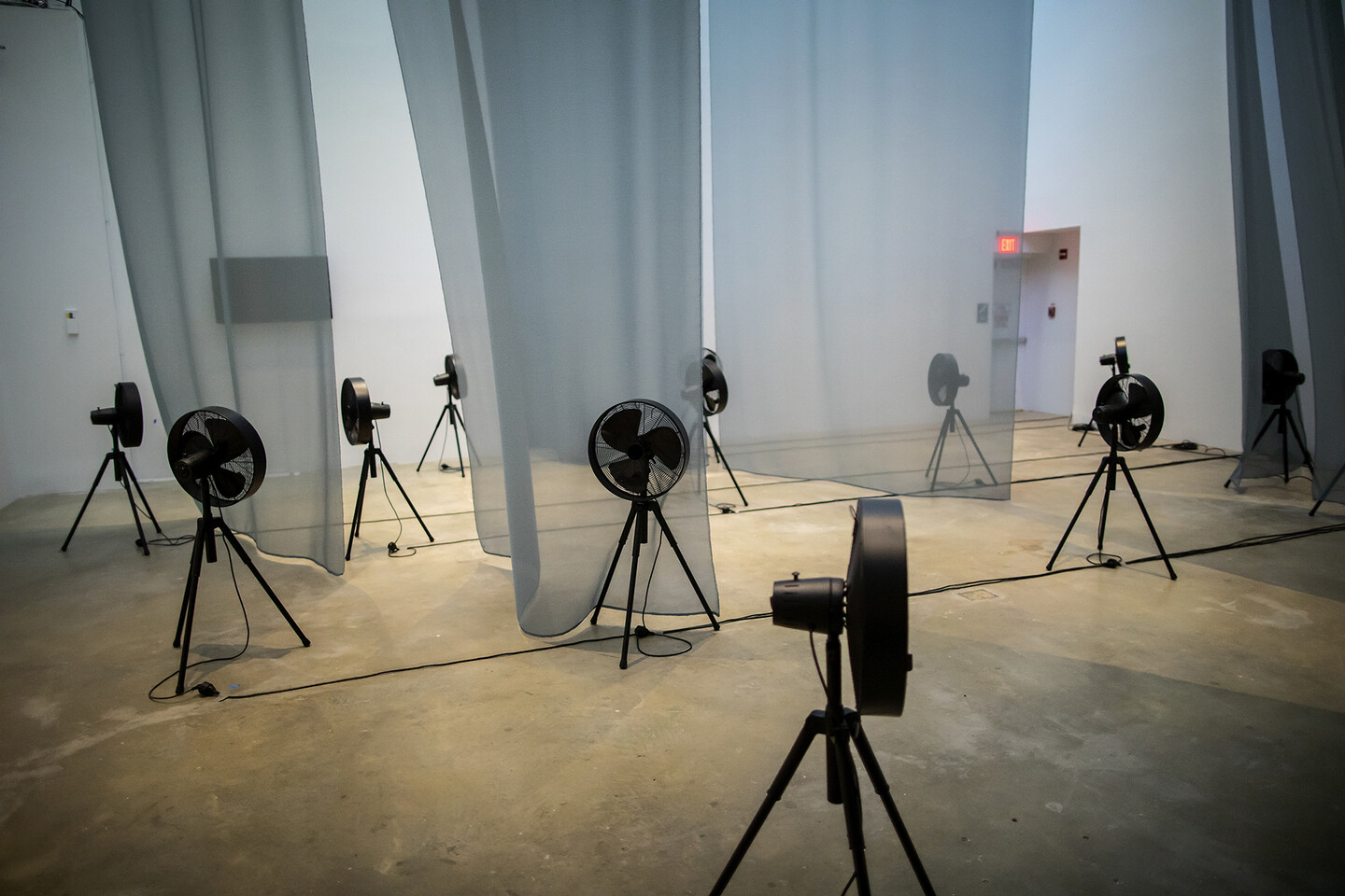 Fans and curtains placed in a gallery