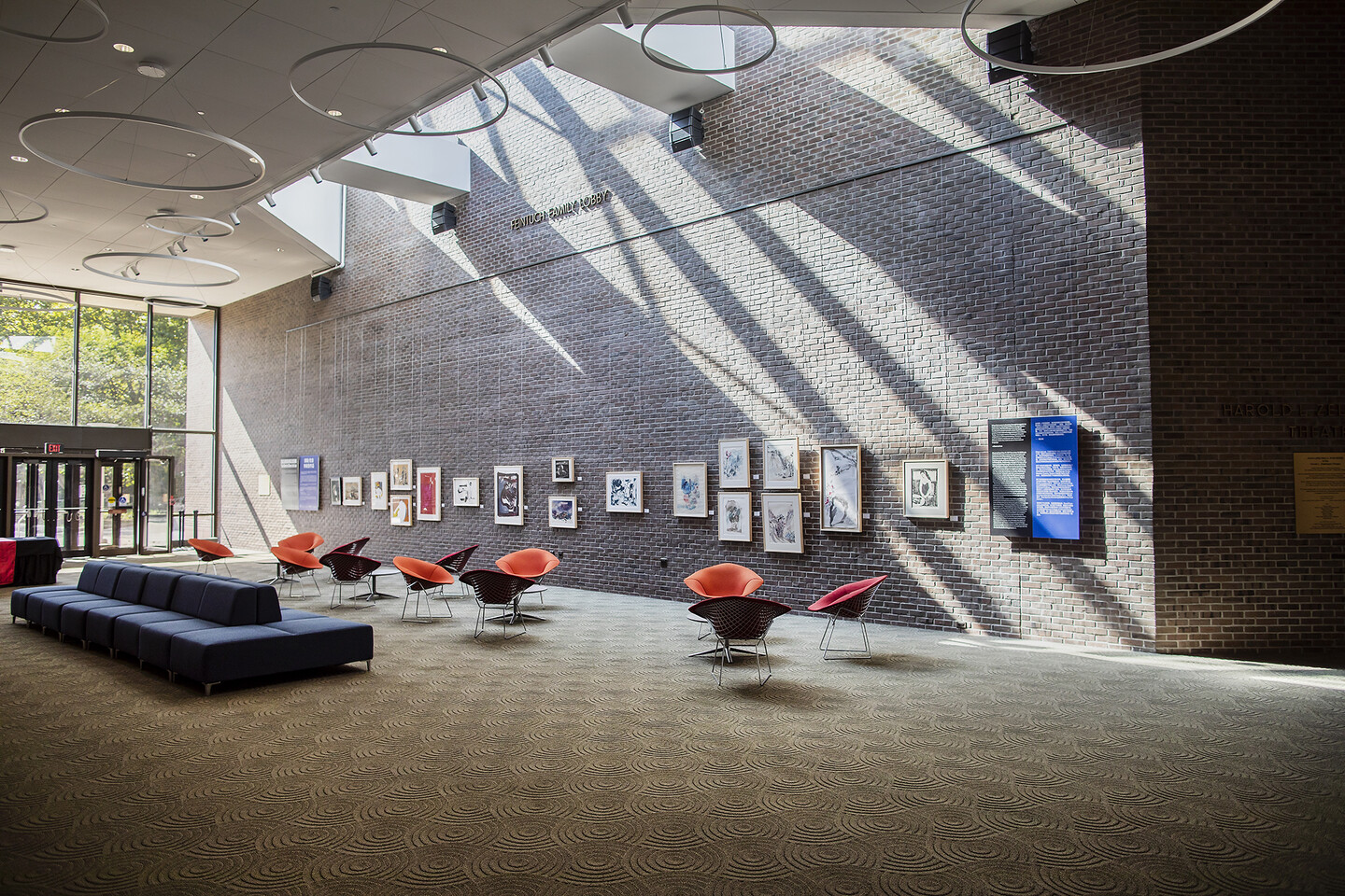 Wide view of artwork on brick wall