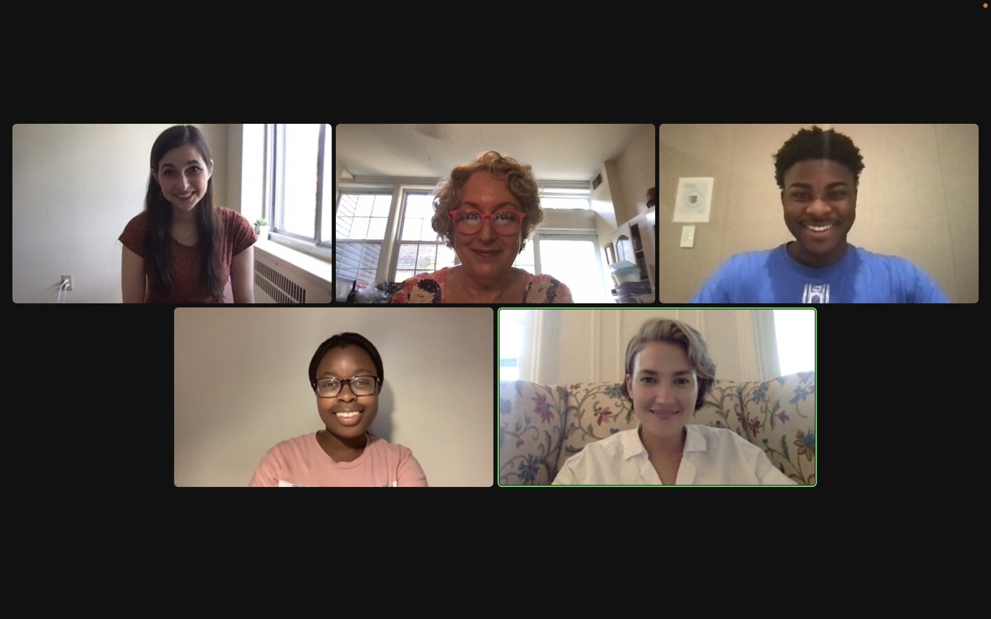 a Zoom screen with five researchers smiling during a meeting