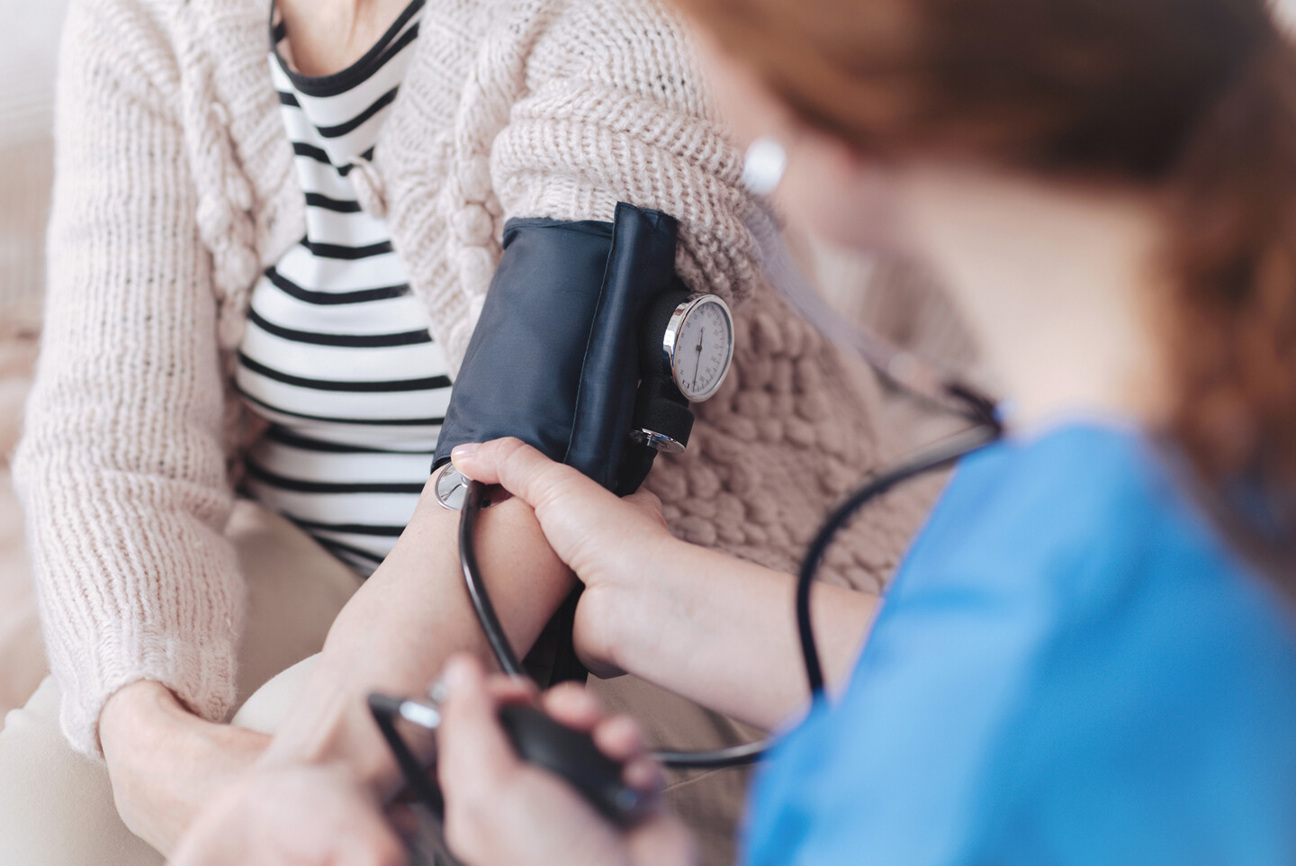 Person getting their blood pressure checked.