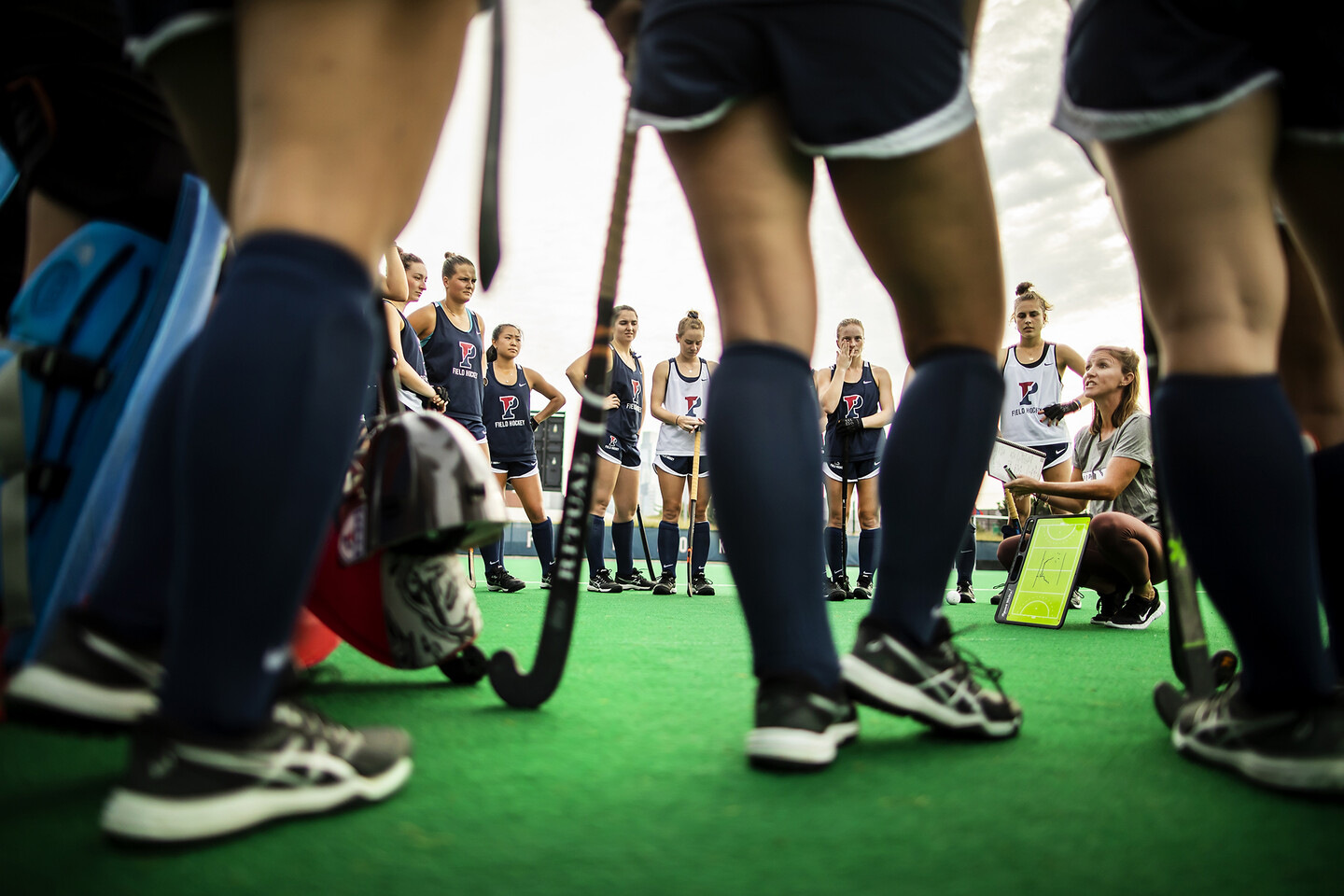 Head Coach Colleen Fink speaks with players during practice.