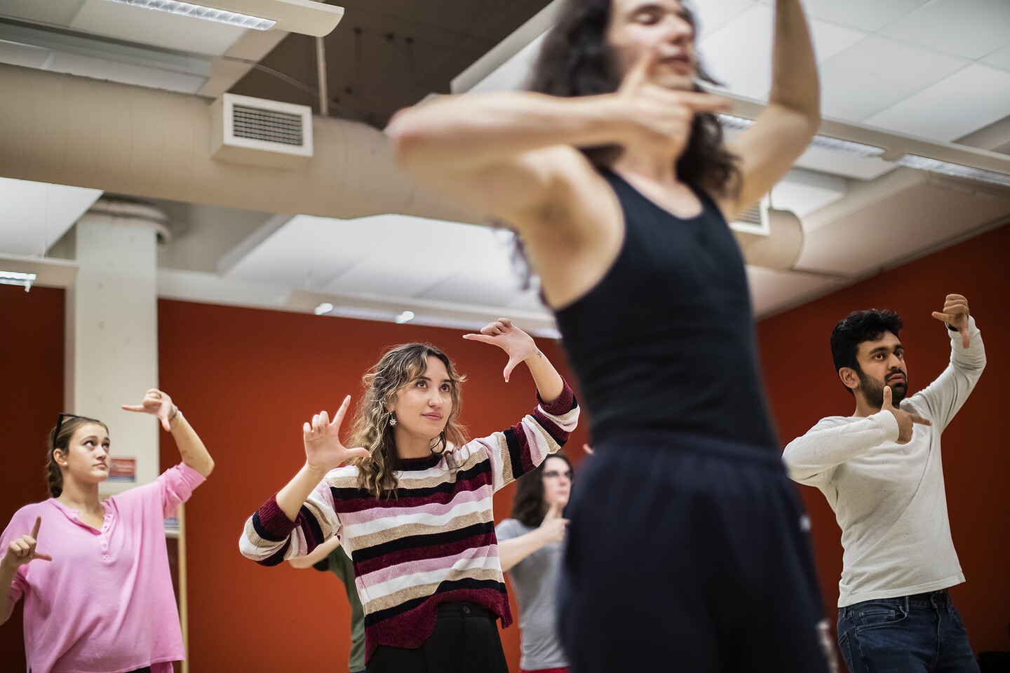 five students rehearsing