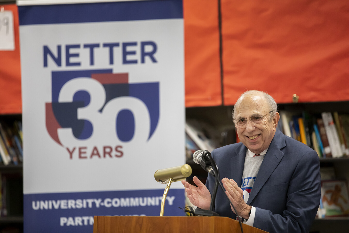 ira harkavy speaks at a podium at the hamilton school