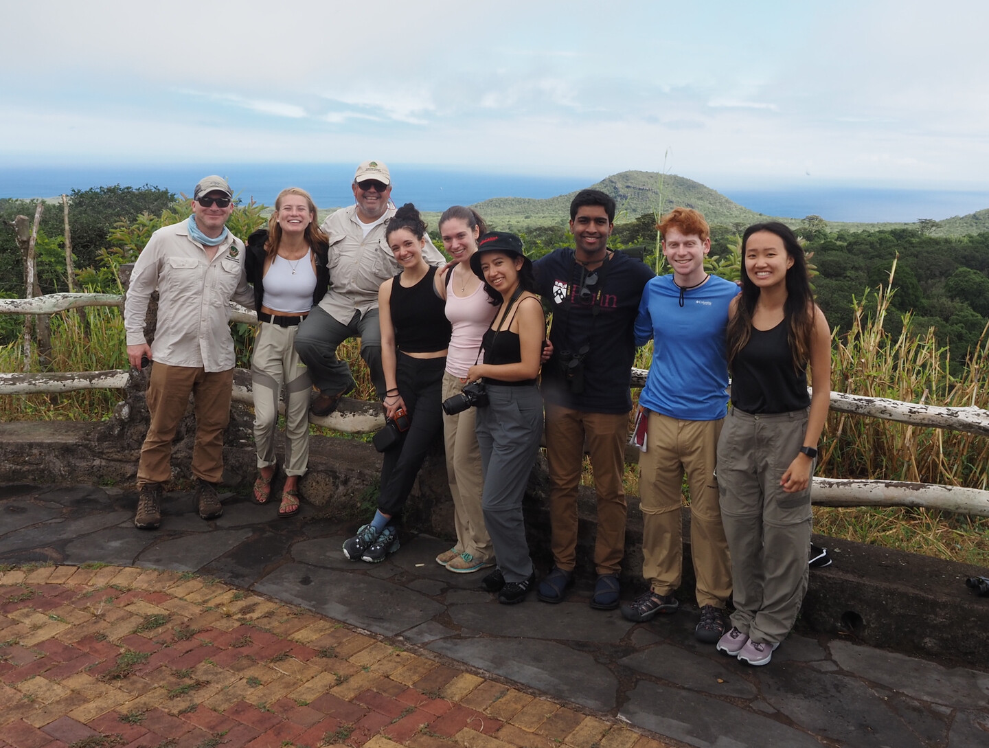 The members of GERA pose for a group photo by the ocean