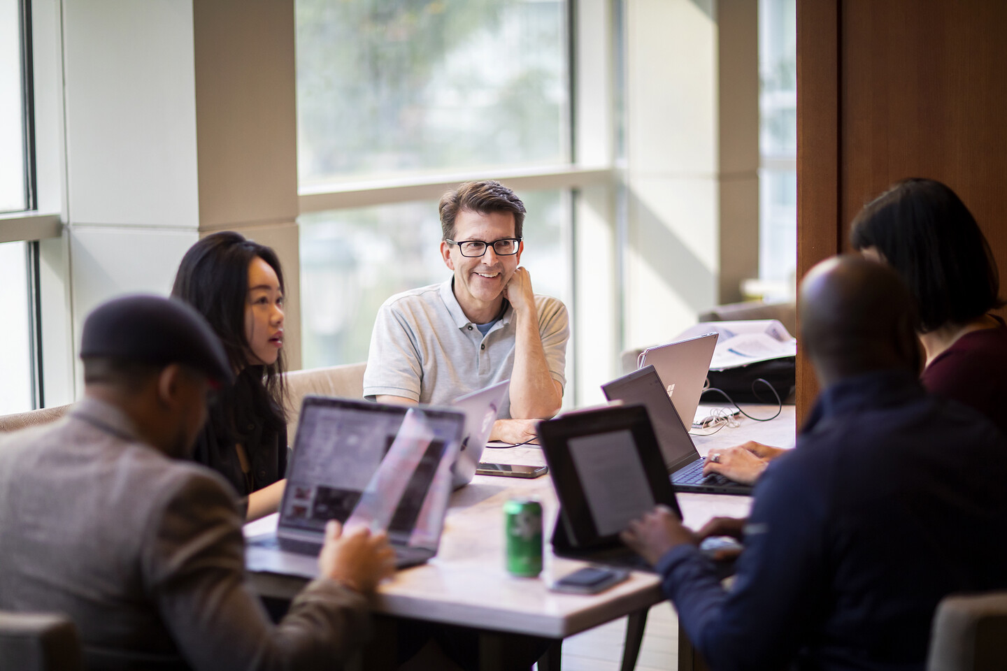 James Timm sitting at table with other students.
