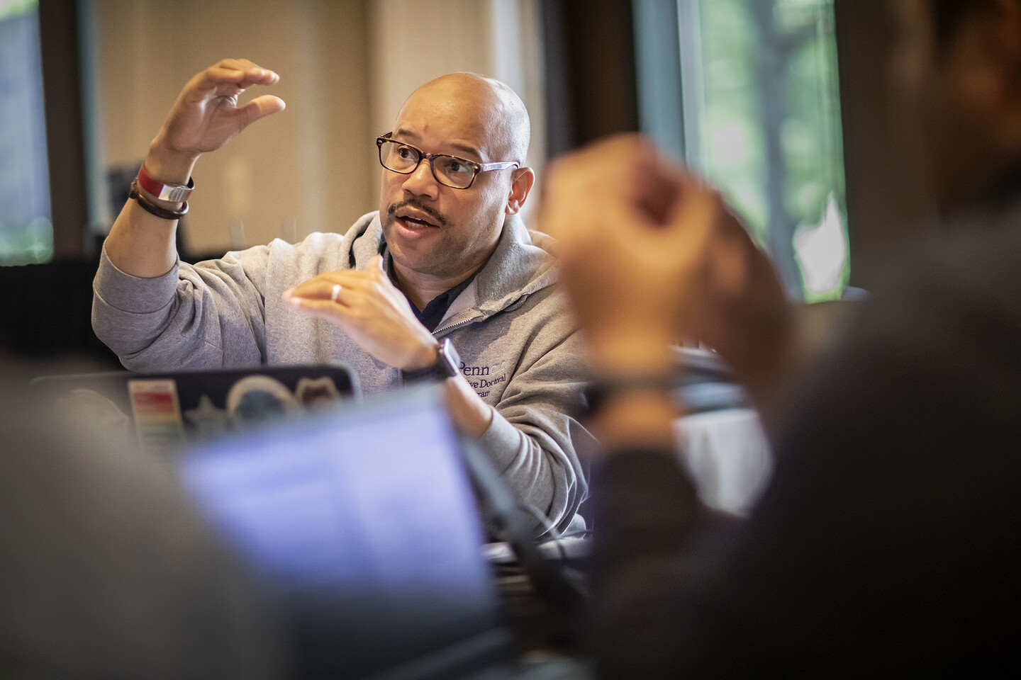John Mackey gesturing with hands while speaking